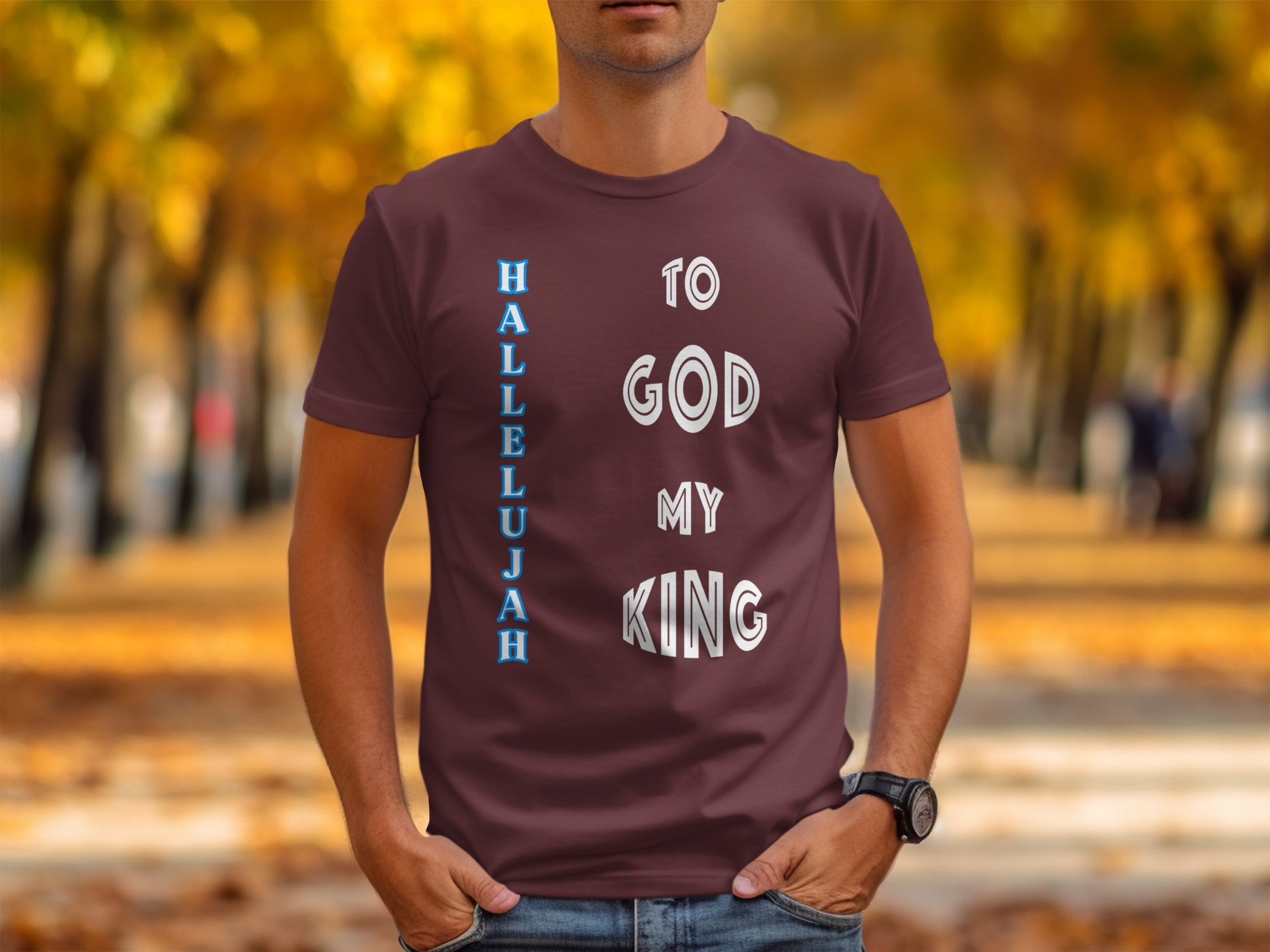 Person wearing a maroon t-shirt with 'Hallelujah to God my King' text in an outdoor setting.