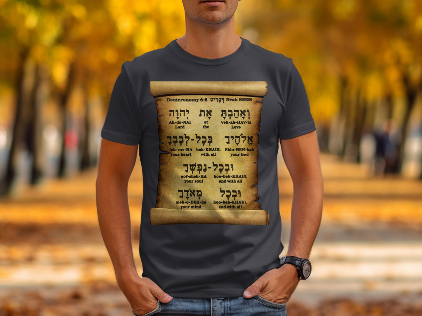 Person wearing a black t-shirt with a printed design of a Torah scroll.