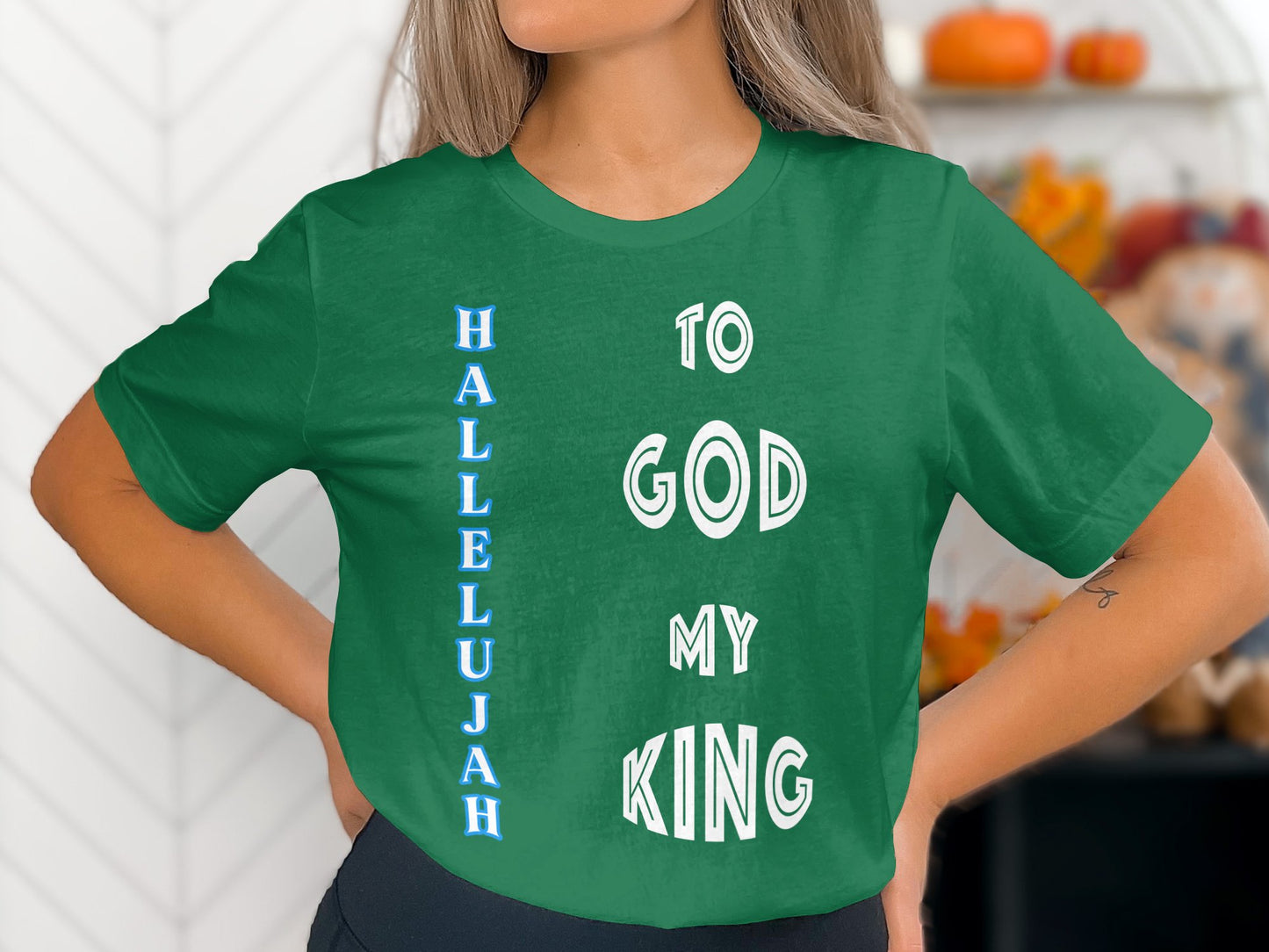 Person wearing a green t-shirt with 'Hallelujah to God my King' text.