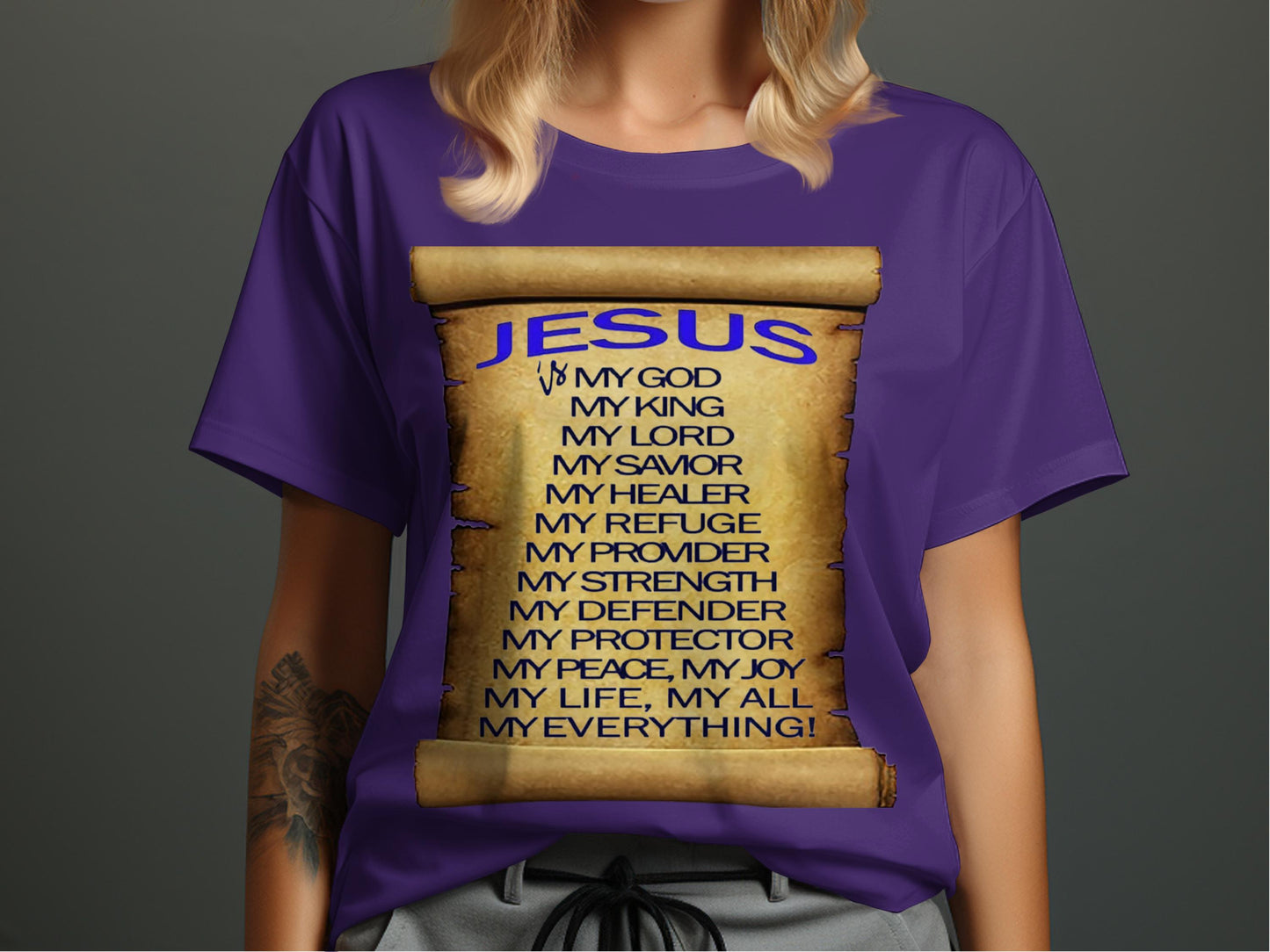 Purple t-shirt with 'Jesus' text design on a plain background