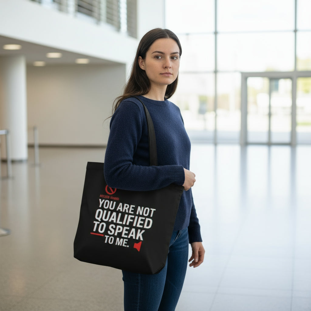 Unapologetically bold and effortlessly cool. This tote bag features the striking phrase: “You Are Not Qualified to Speak to Me” — a confident statement for those who set boundaries and know their worth.