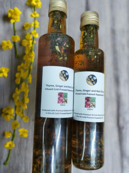 Thyme, ginger and red onion, infused rapeseed oil is in a glass bottle with some bits of thyme, ginger and red onion in the bottle as well as the rapeseed oil.