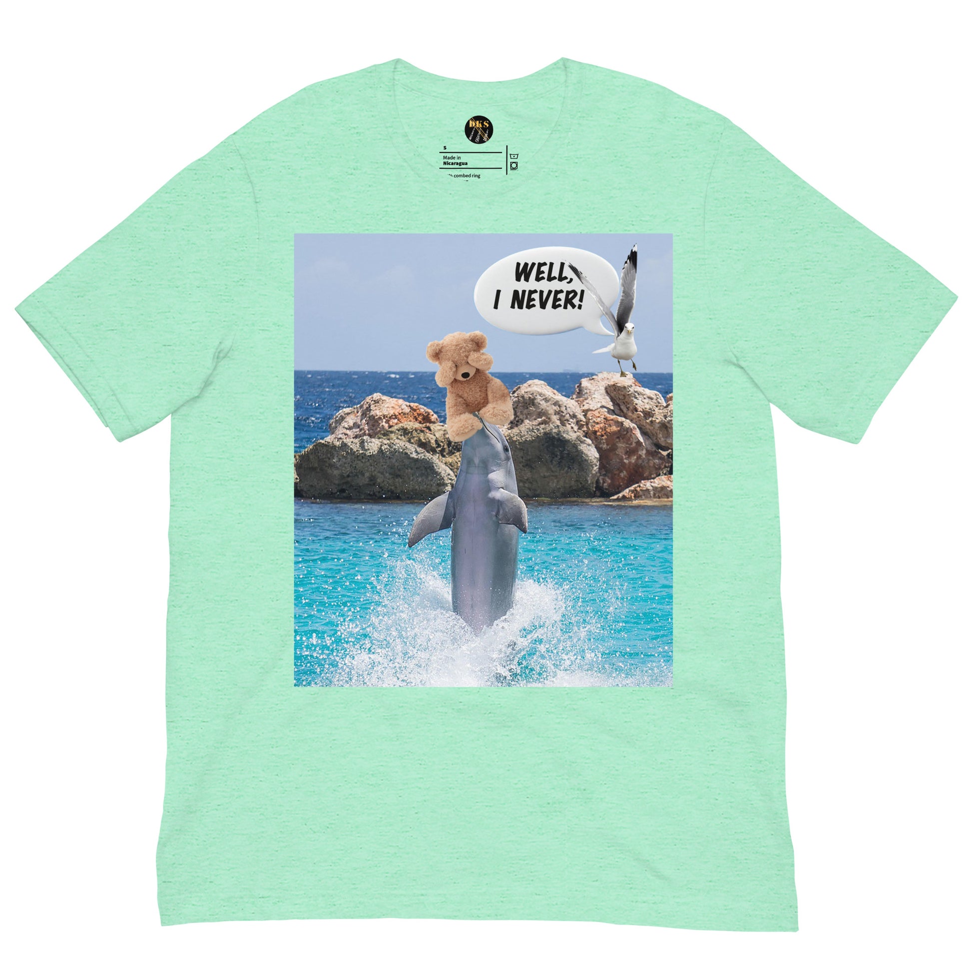 This unisex Bella+Canvas 3001 t-shirt features a playful dolphin juggling a scared teddy bear while a dove looks on, astonished, and exclaims "Well I never!" Made from 100% combed and ring-spun cotton, it's lightweight, soft, and perfect for everyday wear with a modern fit. Ideal for animal lovers, beach vibes, or anyone with a quirky sense of humor.